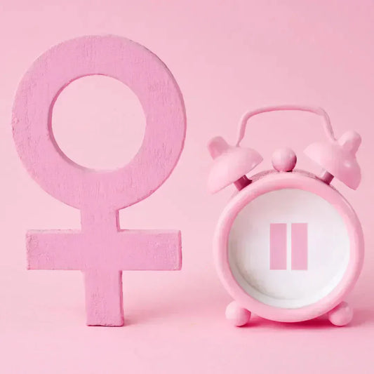 female symbol and clock with pause symbol
